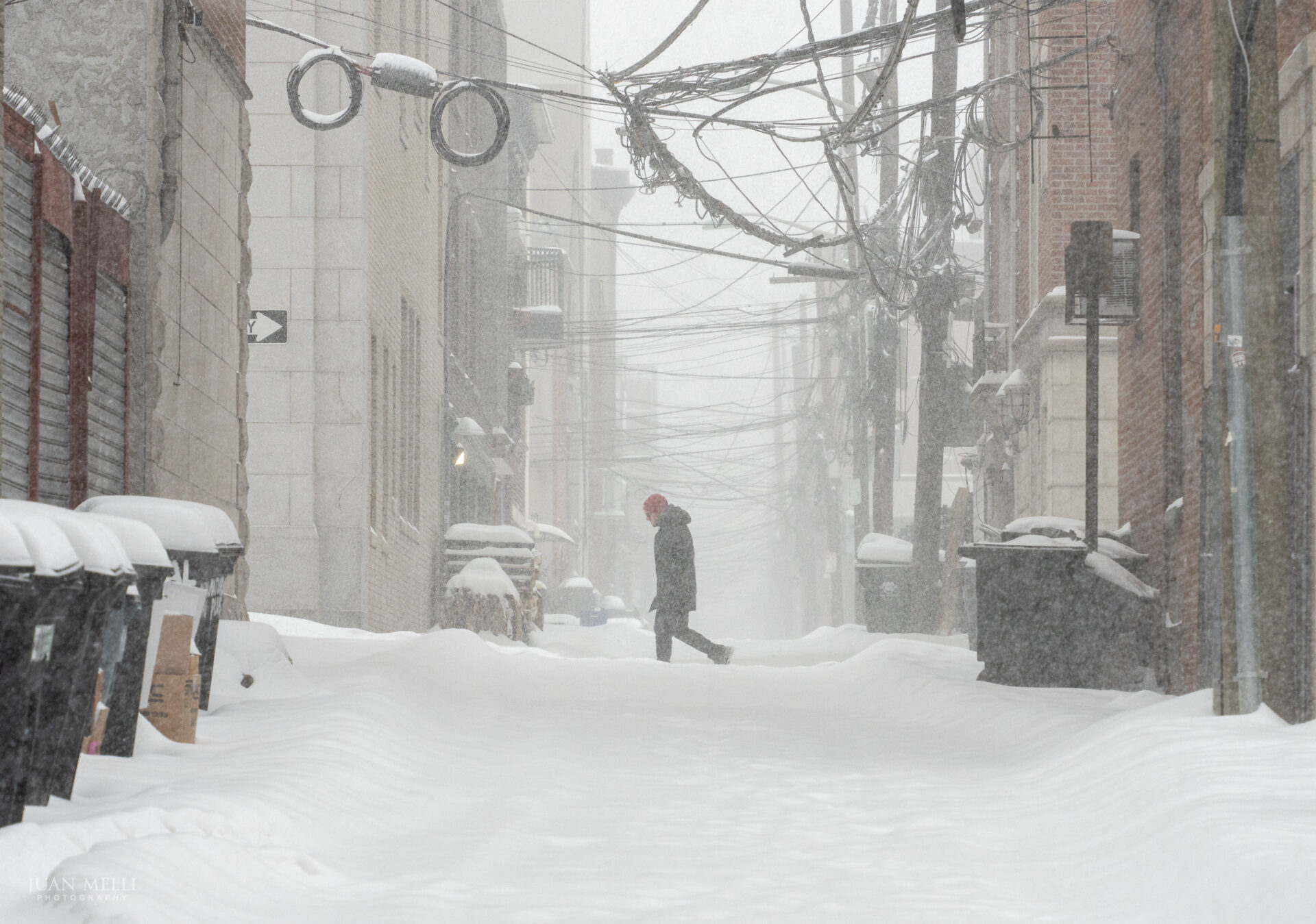 A man walks along 1st Street past historic Court Street